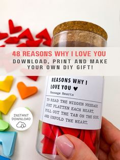 a person holding a jar filled with colorful hearts and the words 48 reasons why i love you