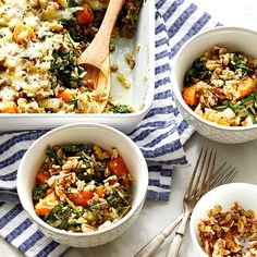 three bowls filled with different types of food on top of a white tablecloth next to silver utensils