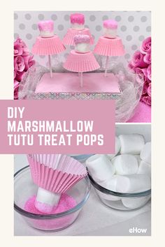 marshmallows in pink and white are arranged on top of the cake stand