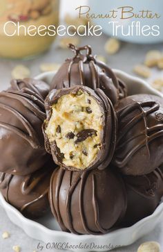 chocolate covered peanut butter cheesecake truffles in a white bowl on a table