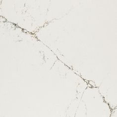 a white marble textured surface with cracks and cracks in the top left hand corner