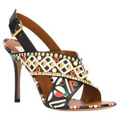 New Valentino Garavani High Heel Embellished Leather Sandals Italian size 41 - US 11 Maria Grazia Chiuri and Pierpaolo Piccioli were thinking deeply about Africa when they were designing for Spring 2016 Collection. In a nod to the colours and patterns of Africa, these grained-leather sandals are hand-painted with tribal-inspired motifs and studded across each strap. Black, grained leather. Debossed-leather and hand-painted tribal motif. Black, green, white and red stud embellished, gold-tone metal setting. Heel height - 4.5 inches, Leather sole and insole. Made in Italy. New without bag, comes with dust bag. Retail $1460.00 Valentino Rockstud Sandals, Italian Sandals, Valentino Flats, Lace Espadrilles, Pierpaolo Piccioli, Jeweled Shoes, Studded Sneakers, Red Studs, Embellished Shoes