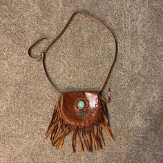 Purchased And Handmade In Thailand. Genuine Leather With Leather Tassels And Stunning Turquoise Accent. Zipper Inside For Change And Adjustable Cross Body Strap. Reasonable Offers Only Please ! Handmade Brown Clutch Shoulder Bag, Brown Leather Festival Bag, Leather Mobile Phone Bag For Festivals, Brown Leather Bag For Festival, Leather Bohemian Pouch Bag, Bohemian Leather Pouch Bag, Brown Hand Tooled Clutch Shoulder Bag, Handmade Brown Shoulder Bag, Handmade Leather Festival Bag