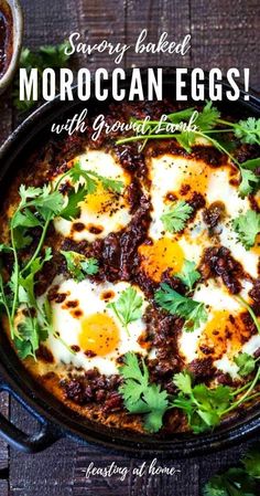 a skillet filled with eggs and garnished with cilantro leaves on top