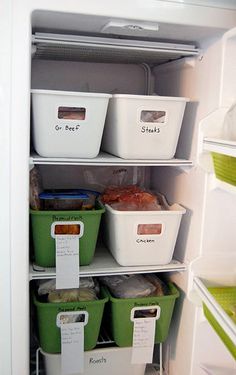 an open refrigerator with several containers and labels on the door to keep food in it