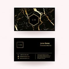 a black and gold marble business card with the letter s m on it's side