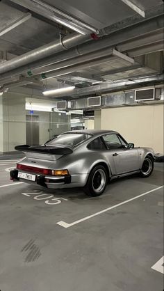 a car is parked in an empty parking garage