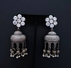 Gather compliments wearing this Indian jhumka earrings with flashy CZ ear studs. In faux diamond, ruby, emerald, and blue sapphire. Voluptuous shape. Very feminine and pretty! Tiny dangly metal balls and pearls finish the look. Earrings are cast metal, not stamped, so they look and feel substantial. find even more great earrings here: https://www.etsy.com/shop/boutiquebymaryam?section_id=22797814 Be sure to visit the rest of my shop here: https://www.etsy.com/shop/boutiquebymaryam All my jewelry Silver Hand-set Jhumkas Drop Earrings, Silver Hand Set Jhumkas Drop Earrings, Silver Hand Set Jhumkas, Silver Hand Set Drop Jhumkas, Silver Jhumkas With Latkans For Anniversary, Silver Fusion Jhumkas For Anniversary, Heavy Dangle Jhumkas For Gift, Heavy Drop Jhumkas As Gift, Fusion Style Drop Jhumkas As A Gift