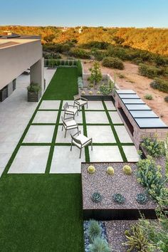 an aerial view of a patio with tables and chairs in the middle of a yard