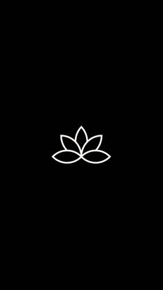 a black background with a white flower on it