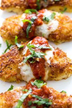 chicken parmesan with tomato sauce and fresh herbs