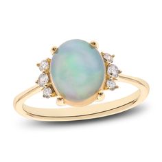 A mesmerizing oval-cut opal is flanked by trios of fiery round diamonds in this captivating women's ring. Fashioned in 14K yellow gold, the total diamond weight of the ring is 1/6 carat. Diamond Solitaire Earrings, Natural Opal Ring, Gold Book, Jared The Galleria Of Jewelry, Yellow Gold Engagement, Opal Ring, Natural Opal, Opal Jewelry, Diamond Stone