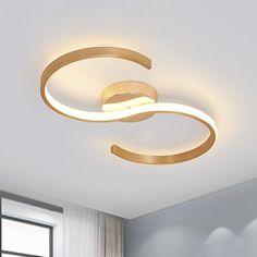 a modern ceiling light in a white room