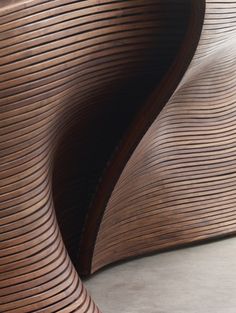 a close up of a wooden object with wavy lines on it's sides and bottom