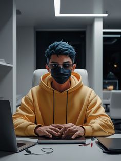 a man wearing a face mask sitting at a desk in front of a laptop computer