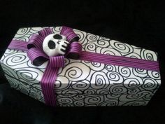 a wrapped present with a skull on it