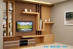 a living room filled with furniture and a flat screen tv on top of a wooden entertainment center