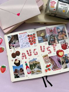 an open photo album with pictures and stickers on it next to a camera, envelope, and other items