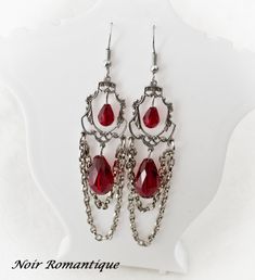 Noir Romantique♥ Welcome to my store :) Made of elegant silver ornate connectors red teardrop gems and chain . ♥ Nickel and lead free. If you have allergy to simple earwires, please leave a note in your order,so I can substitute them with Sterling Silver earwires . ♥They will be sent to you in a beautiful gift box and carefully gft wrapped in a safety envelope through registered mail (this means that tracking number will be provided to you as soon as your order will be sent). ♥If you have any qu Gothic Dangle Earrings For Wedding, Vampire Style Dangle Jewelry For Party, Vampire Style Dangle Party Jewelry, Red Elegant Nickel-free Teardrop Earrings, Victorian Dangle Chandelier Earrings For Parties, Victorian Chandelier Dangle Earrings For Party, Nickel Free Elegant Red Chandelier Earrings, Elegant Nickel-free Red Chandelier Earrings, Victorian Style Party Chandelier Earrings