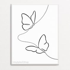 a black and white drawing of two butterflies