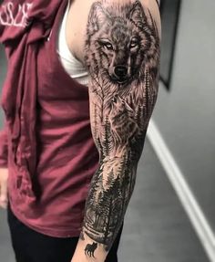 a man with a wolf tattoo on his arm