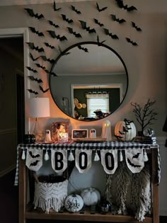 a decorated halloween table with bats on it