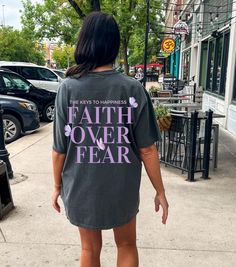 ABOUT OUR Faith over Fear      👉 Unisex T-shirt - 100% Airlume combed and ringspun cotton  - Soft cotton and quality print make users fall in love with it over and over again.  - These t-shirts have-ribbed knit collars to bolster shaping. - Printed and shipped from the USA CARE INSTRUCTIONS - Wash inside out with like colors. - Tumble dry or hang to dry. - Try not to iron directly over the design. Iron if necessary!  HOW TO ORDER  1) Please, check and review all photos  2) Choose your sweatshir Faith Over Fear Shirt, Bible Verse Tees, Mental Stability, Faith Based Clothing, Gym Tees, Jesus Shirt, Faith Over Fear, Christian Shirt, Inspirational Shirt