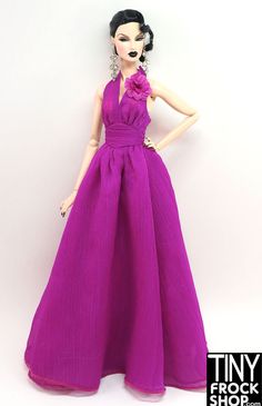 a barbie doll wearing a purple dress