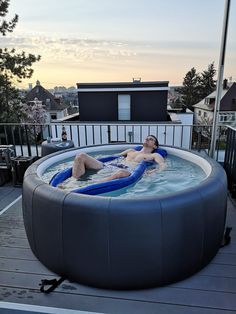 a man is relaxing in an outdoor hot tub