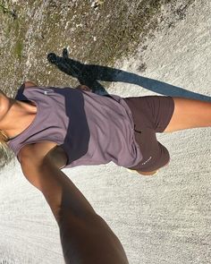 a woman standing on top of a tennis court with her racquet in her hand