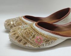 Introducing our exquisite handcrafted ladies Cream & Beige khussa jutti, a blend of elegance and tradition designed to adorn your feet with timeless beauty. Crafted with meticulous attention to detail, this stunning khussa features a captivating Grey hue embellished with a delicate gold floral pattern, accentuated by shimmering sequins for a touch of opulence. NOTE : Product colour may slightly vary. Thank you Jutti Punjabi, Punjabi Jutti, Punjabi Wedding, Happy Birthday Gifts, Cream Beige, Embroidery Work, Wedding Shoes, Timeless Beauty, Indian Wedding