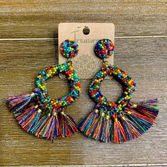 Multi Colored Beaded Earrings Casual Multicolor Earrings For Festivals, Casual Multicolor Festival Earrings, Multicolor Tassel Earrings With Round Beads, Multicolor Drop Tassel Earrings For Beach, Multicolor Tassel Drop Earrings For Beach, Multicolor Beaded Earrings For Beach, Multicolor Casual Jewelry With Tassels, Casual Multicolor Dangle Beaded Earrings, Casual Multicolor Beaded Dangle Earrings