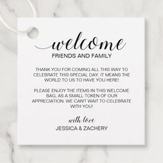 a white card with the words welcome friends and family on it