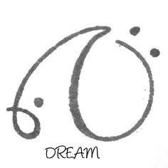 the word dream written in black ink on a white paper