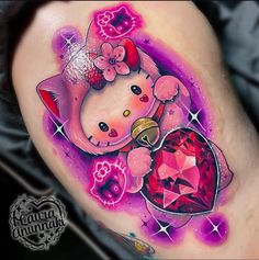 a tattoo with a pink bear holding a heart on it's thigh, and an orange diamond in the center