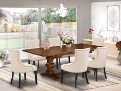 a dining room table with white chairs and flowers in vases on the floor next to it