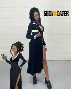 a woman standing next to a cardboard cutout of herself and an afro american girl