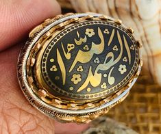 Islamic Moslem Islam Muslim Shia Ring Arabic Koran Calligraphy Hadid 925 Sterling Silver Ring الله صمد Stone size 18mm x 25 mm Gold section is bronze Traditional Oval Engraved Rings, Symbolic Carved Engraved Ring As Gift, Symbolic Engraved Carved Ring As Gift, Traditional Polished Signet Ring As Gift, Symbolic Engraved Carved Ring For Gift, Traditional Polished Signet Ring Gift, Traditional Engraved Signet Ring Collectible, Traditional Oval Engraved Ring As Gift, Traditional Oval Engraved Ring For Gift