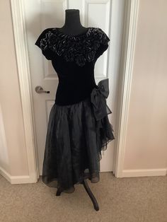 This great vintage 80s 90s designer Preference black & silver velvet like scoop neck gathered waist high low dress with huge bow on side comes to you in a size M. Great vintage cond. pls compare measurements I give you to those in your closet. They are 14 inches waist across-18 inches underarm to underarm. Hips n/a Dress Clothes For Women, Black Velvet, High Low Dress, High Low, Black Silver, Scoop Neck, Dress Outfits, Velvet, Womens Dresses