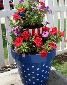 patriotic flower pots are stacked on top of each other