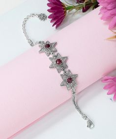 Ruby Corundum 925 Sterling Silver Boho Bracelet Artisan Handcrafted Genuine Filigree Adjustable Star Bracelet Women Handmade Jewelry Material: 925 Sterling Silver ( NICKEL FREE ) Bracelet Length: 7 Inches + 2 Inches Extender Bracelets Width: 2.2 cm // 0.79 Inches Gemstone: Ruby Corundum 6 mm 3.5 ct. FREE, FAST AND TRACKABLE SHIPPING FOR ALL EU COUNTRIES AND USA. COMES WİTH VELVET POUCH AND LUXURY GİFT BOX. This bracelet add a bold fashion statement to any look with Ruby Gemstones. The handcrafted designs that make a beautiful fashion statement. This vintage, original, and stylish luxury jewelry is perfect for wearing at parties, festivals and everyday life. Comes with a gift pouch and box. This handmade silver filigree bracelet is the perfect gift for a mom, wife, daughter, friend, lover, Adjustable Silver Charm Bracelet For Festive Occasions, Festive Adjustable Silver Crystal Bracelet, Adjustable Silver Crystal Bracelet For Festive Occasions, Handmade Silver Star Bracelets, Handmade Silver Star Bracelet, Traditional Silver Crystal Bracelet As Gift, Traditional Silver Crystal Bracelet Gift, Traditional Silver Crystal Bracelet For Gift, Filigree Bracelet