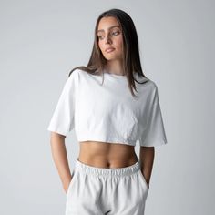 Our latest cropped tee is contoured to perfection with our Dart fabric technique. Our goal was to create a piece that’s super relaxed and extremely flattering all at the same time. This piece is made from 100% heavyweight jersey cotton and features dropped shoulders and vertical darts. Our darts are placed at the front and back of the tee providing the perfect shape to enhance your curves. Tailored by TALENTLESS. White Relaxed Fit Crop Top, White Relaxed Fit Crop Top With Cropped Hem, Sporty Boxy Fit Cropped Shirt, Boxy Fit Sporty Cropped Shirt, Relaxed Fit Cropped Cotton T-shirt, Cropped Boxy Fit Tops, Sporty Boxy Fit Cropped T-shirt, Sporty Relaxed Fit Cropped T-shirt, Boxy Fit Cropped Tops