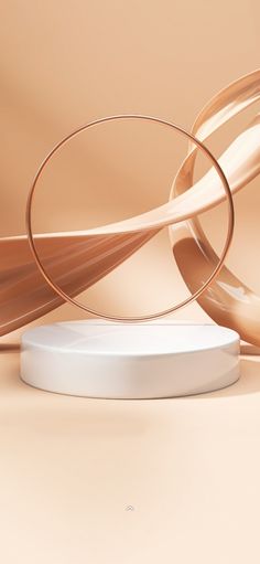 a white round object sitting on top of a table next to some brown and beige lines