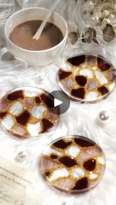 three brown and white plates sitting on top of a table next to a cup of coffee