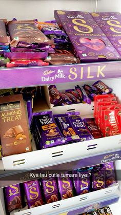 dairy milk and silk chocolates on display in a store