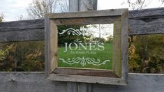 a wooden frame holding a sign that says, the jones on it's side