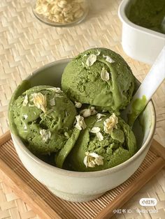 three scoops of green tea ice cream in a bowl