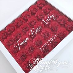 a white box filled with red roses in it's side and the words tiara rose written on top