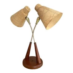 two wooden desk lamps on top of each other