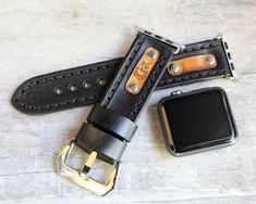 "Handmade apple watch band in black color, made with vegetable tanned leather and with a personalized leather tag. Add your monogram to personalize your apple watch band. The band is compatible with Series 1-6 apple watches. Each item is handmade and designed by Cuckoo Nest Art Studio™. The watch bands made from vegetable tanned leather what is known as the highest quality leather available and used for high-end handmade leather goods. Usually, this kind of leather is stiff in the beginning howe Black Leather Strap Apple Watch Band For Everyday Use, Black Watch Band For Everyday Use, Black Bracelet Strap Apple Watch Band For Everyday, Black Watch Bands With Wrist Strap For Everyday Use, Luxury Black Watch Band For Everyday Use, Adjustable Black Watch Bands With Custom Hardware, Black Apple Watch, Apple Watch Cuff, Black Apple Watch Band